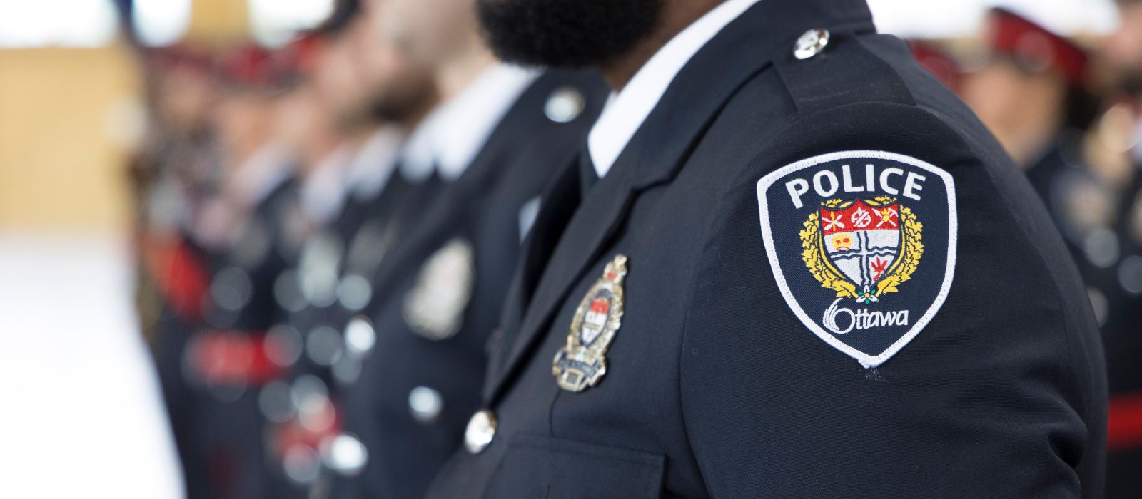 Officer standing at attention in dress uniform