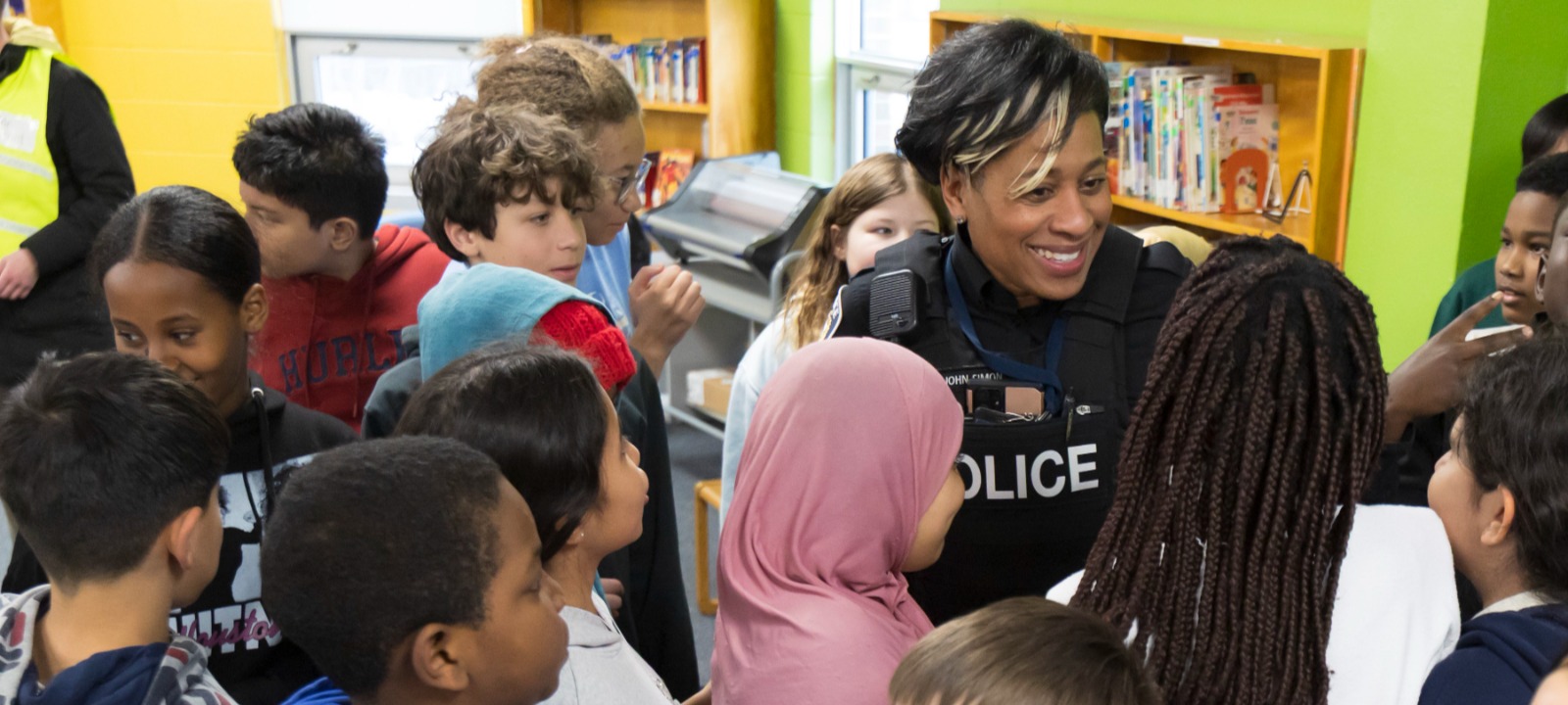 Police officer visitin students in a school