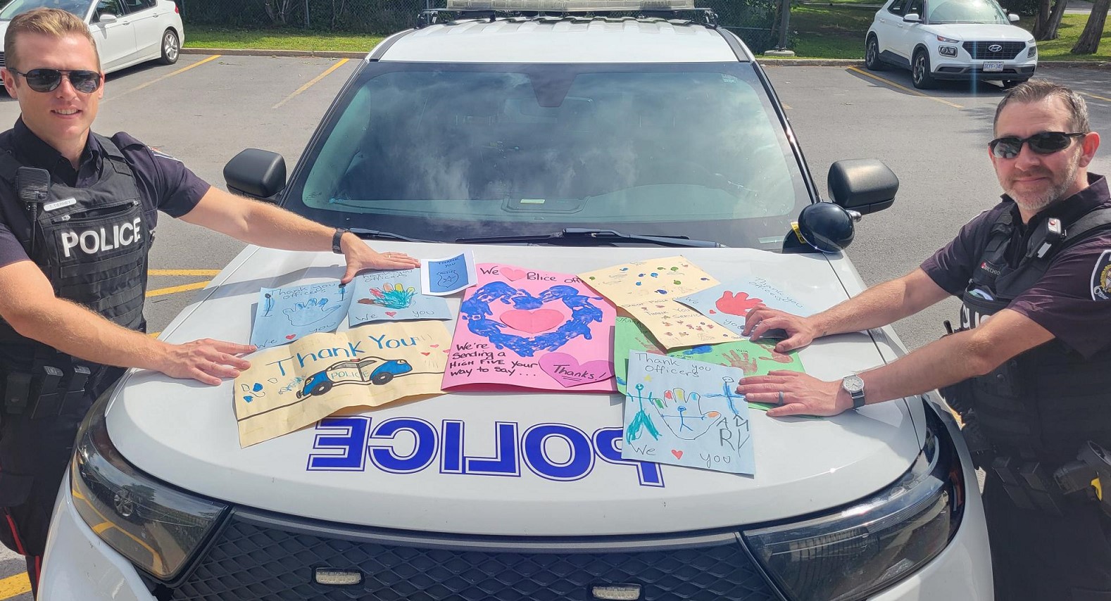 Little Witnesses, Big Impact: Community Youth Unit Turns Fear into Friendship at Ottawa Daycare Officers show the thank you cards children made for them
