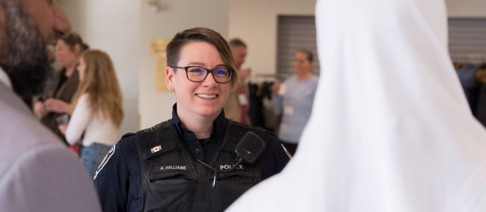 Police officer chatting with members of the community.