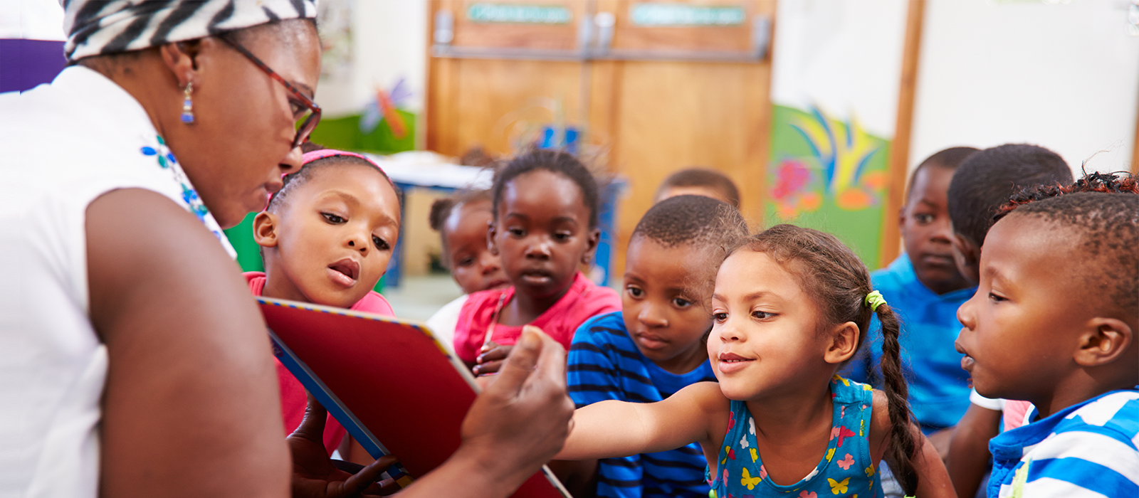 An image of a woman working with children