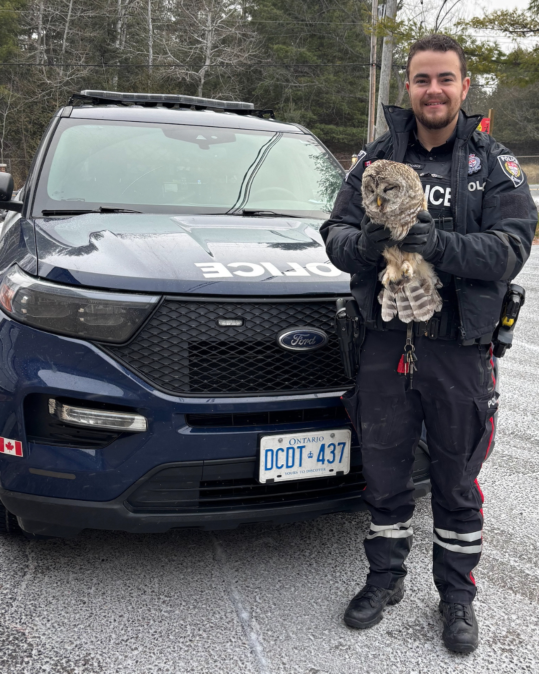 Constables Young with the rescued owl