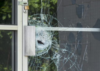 Damage/mischief to property: a business’ shattered glass door.
