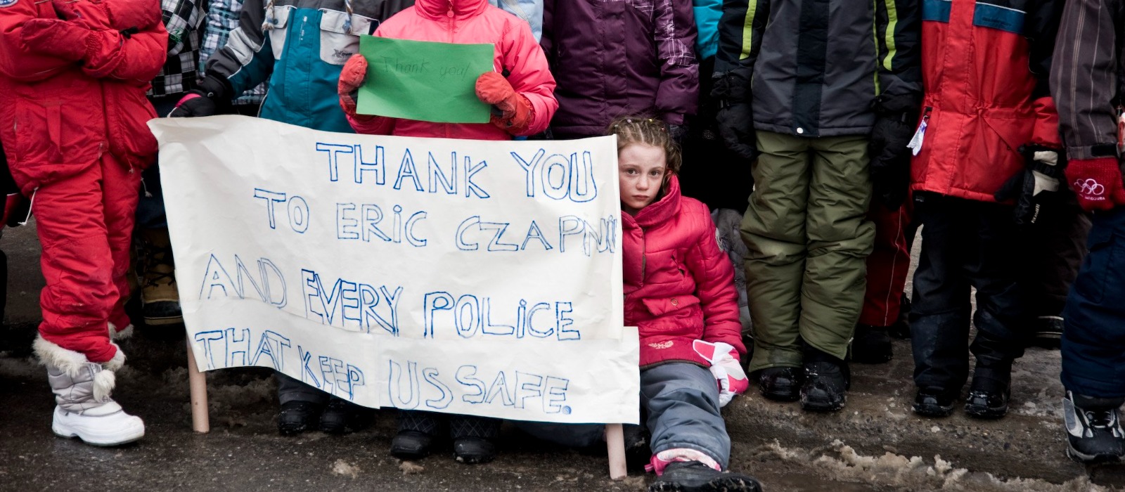 Children lining Constable Eric Czapnik's funeral procession