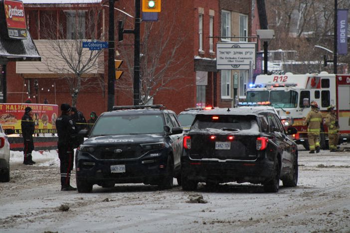 Officers at the scene of a fatal collision on Rideau Street