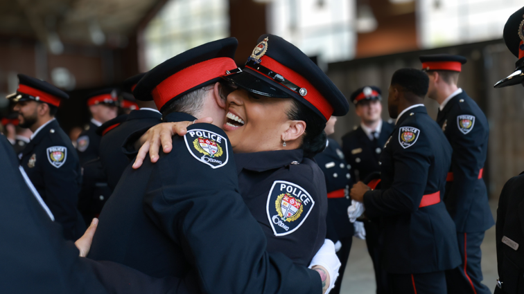 Two officers hugging at an Ottawa Police Service Badge Ceremony