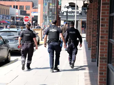 Police officers and a Special Constable walking in downtown Ottawa