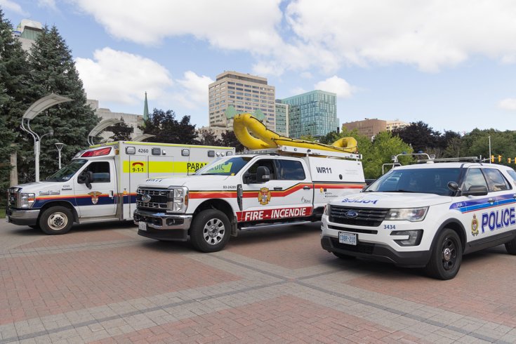 An Ottawa ambulance, an Ottawa fire truck and an Ottawa Police cruiser.